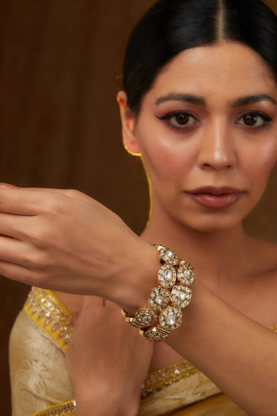 Woman wearing a Gold Finish Kundan Polki Kadas