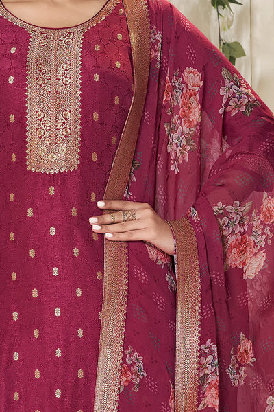 Maroon embroidered traditional outfit with floral patternsMaroon embroidered traditional outfit with floral patterns