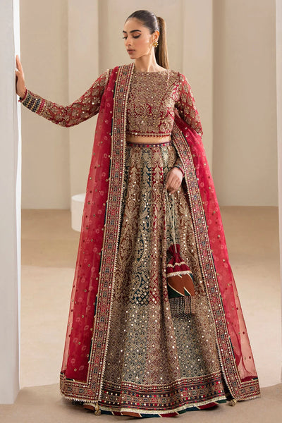 Woman wearing a traditional red embroidered Chiffon Bridal Lehenga outfit with a red dupatta in a neutral setting