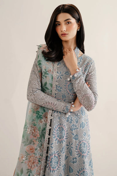 Woman wearing a traditional outfit with embroidered chiffon anarkali top and light blue palazzo pants on a plain backgroundWoman wearing a traditional outfit with embroidered chiffon anarkali top and light blue palazzo pants on a plain background