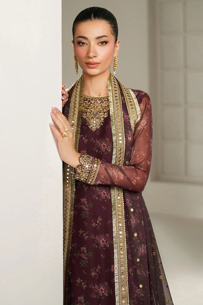 Woman wearing a traditional salwar suit outfit with a long embroidered kameez and matching salwar on a plain backgroundWoman wearing a traditional salwar suit outfit with a long embroidered kameez and matching salwar on a plain background