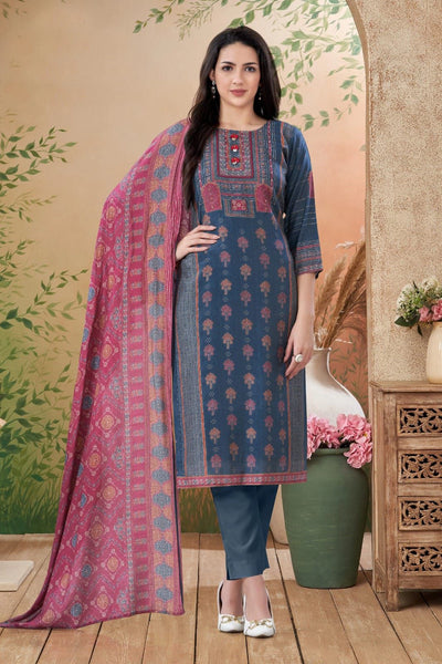 Woman wearing a blue gray and pink dupatta traditional outfit with a floral background