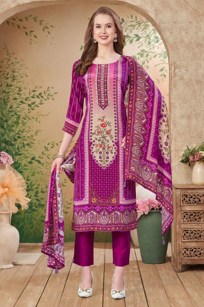 Woman wearing a purple embroidered kurta set outfit in a decorated room.