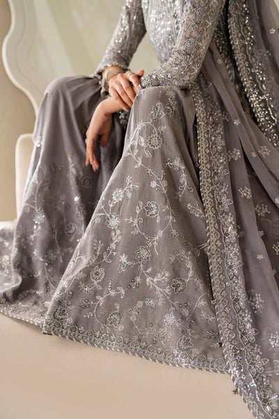 Gray embroidered traditional outfit with intricate patterns on a neutral backgroundGray embroidered traditional outfit with intricate patterns on a neutral background