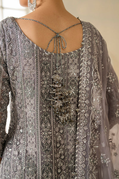 Gray embroidered traditional outfit with intricate patterns and embellishments.Gray embroidered traditional outfit with intricate patterns and embellishments.