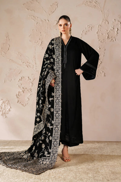 Woman in a black outfit with a large black embroidered velvet shawl Woman in a black outfit with a large black embroidered velvet shawl 