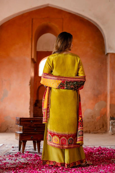 Women wearing Mehendi Green Crepe Silk Palazzo Style Kurta SetWomen wearing Mehendi Green Crepe Silk Palazzo Style Kurta Set