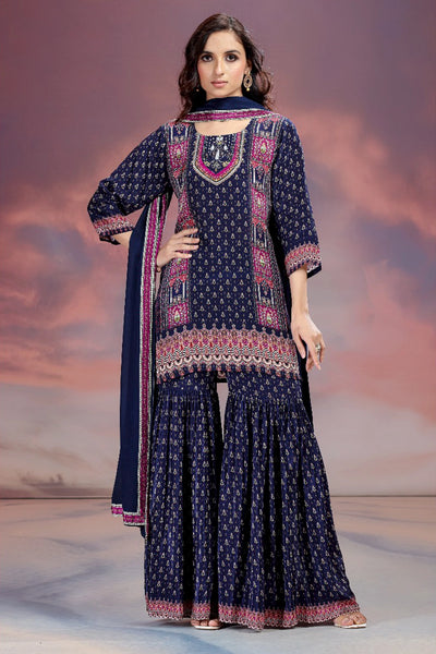 Woman wearing a traditional outfit with a patterned design against a cloudy sky background