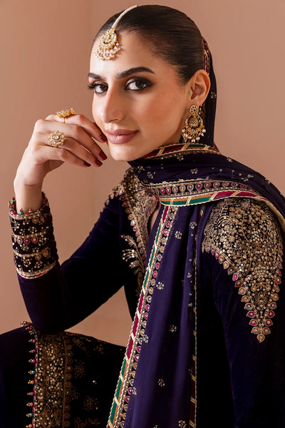 Woman in traditional embroidered outfit with jewelry against a beige backgroundWoman in traditional embroidered outfit with jewelry against a beige background