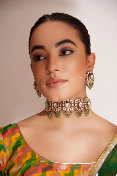 Woman wearing a Gold Finish Mint Green Polki Choker Necklace Set
