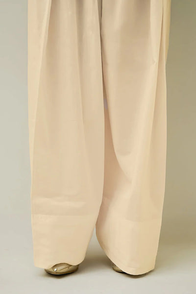 Beige farshi salwar pants on a neutral backgroundBeige farshi salwar pants on a neutral background