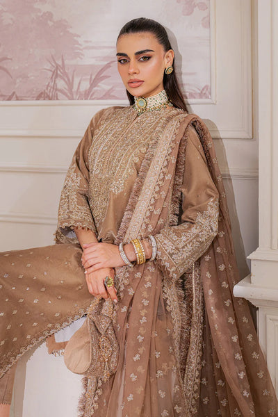 Woman in a traditional brown and beige embroidered outfit sitting indoors.Woman in a traditional brown and beige embroidered outfit sitting indoors.