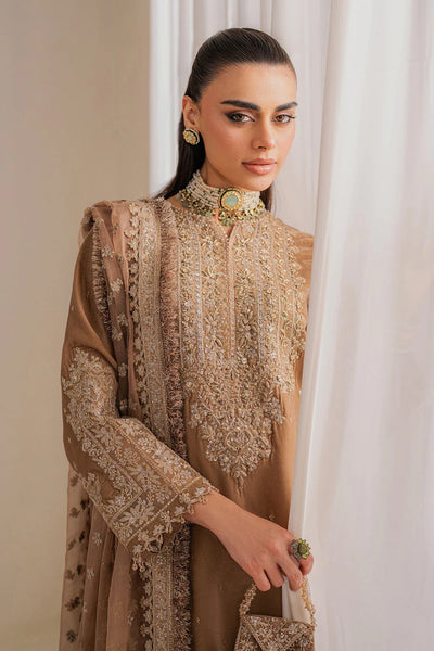 Woman wearing a beige velvet salwar suit embroidered outfit in a minimalistic settingWoman wearing a beige velvet salwar suit embroidered outfit in a minimalistic setting