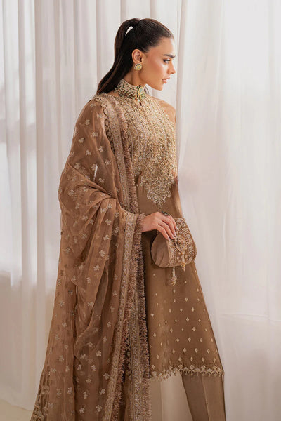 Woman wearing a beige velvet salwar suit embroidered outfit in a minimalistic settingWoman wearing a beige velvet salwar suit embroidered outfit in a minimalistic setting