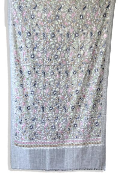 Embroidered shawl with floral kashmiri work on a gray backgroundEmbroidered shawl with floral kashmiri work on a gray background