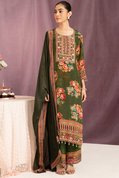 Woman wearing a traditional embroidered green dress with a matching dupatta against a purple background