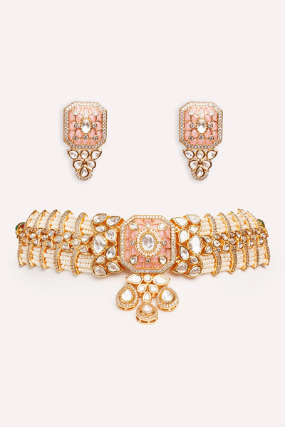 Kundan Jewelry set with choker and earrings on a white backgroundKundan Jewelry set with choker and earrings on a white background