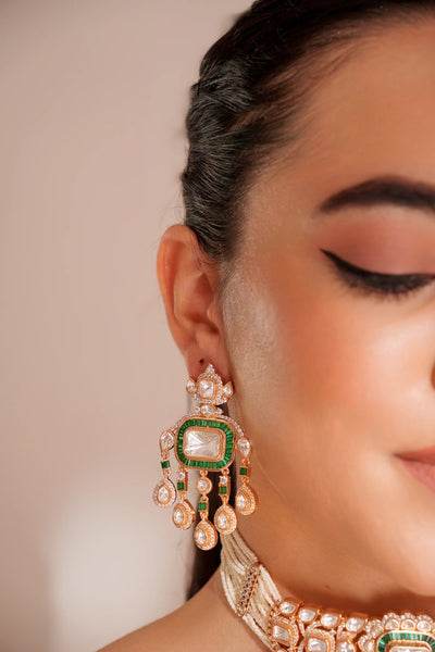 Close-up of a woman wearing ornate earrings with a neutral backgroundClose-up of a woman wearing ornate earrings with a neutral background