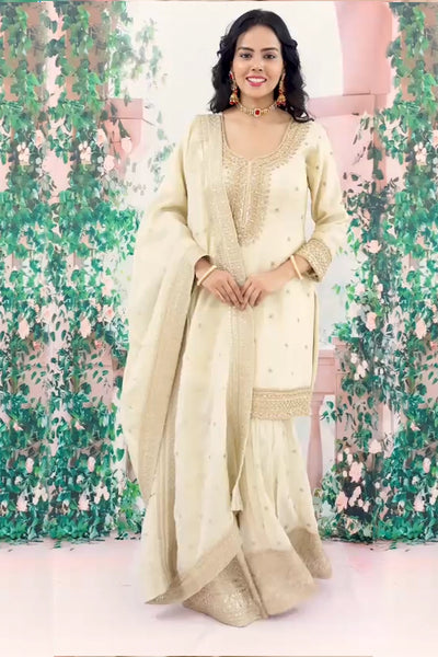 Buy Ivory Embroidered Shimmer Silk Gharara Style Suit at PinkPhulkariBuy Ivory Embroidered Shimmer Silk Gharara Style Suit at PinkPhulkari