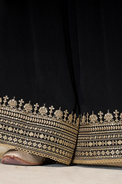 Black chinon silk fabric with intricate gold embroidery on a plain sharara bottomBlack chinon silk fabric with intricate gold embroidery on a plain sharara bottom
