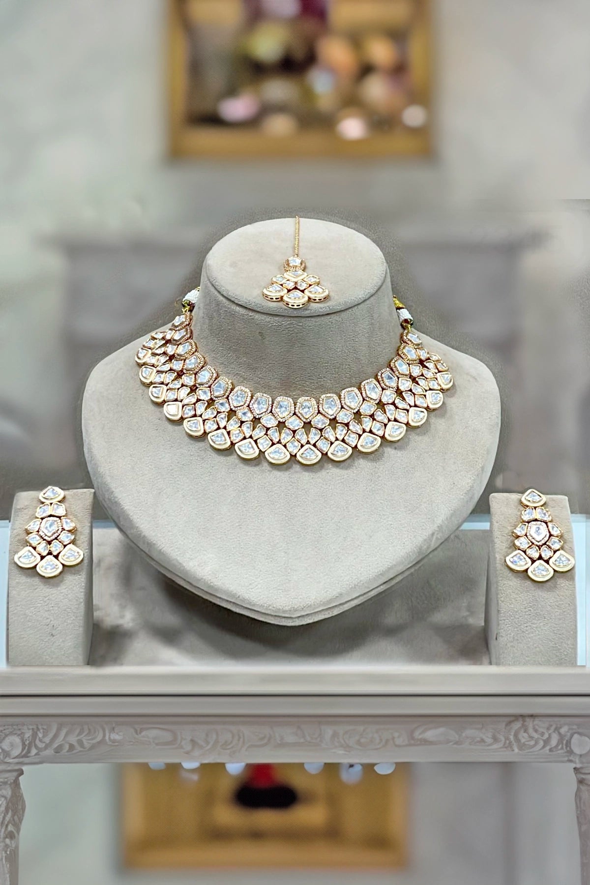 Kundan Jewelry set including a necklace, earrings and tikka