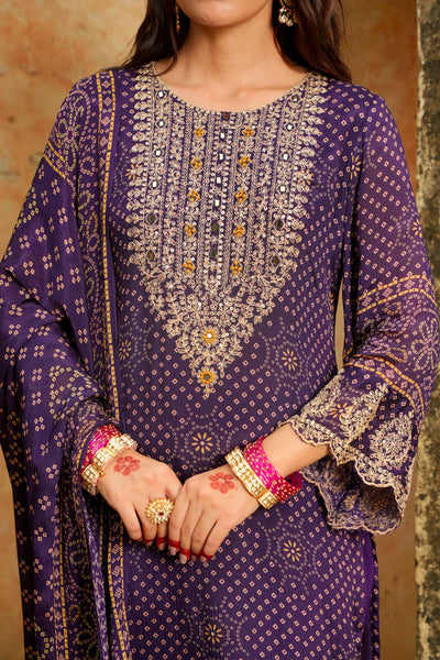 Purple traditional outfit with intricate patterns and embellishments.Purple traditional outfit with intricate patterns and embellishments.