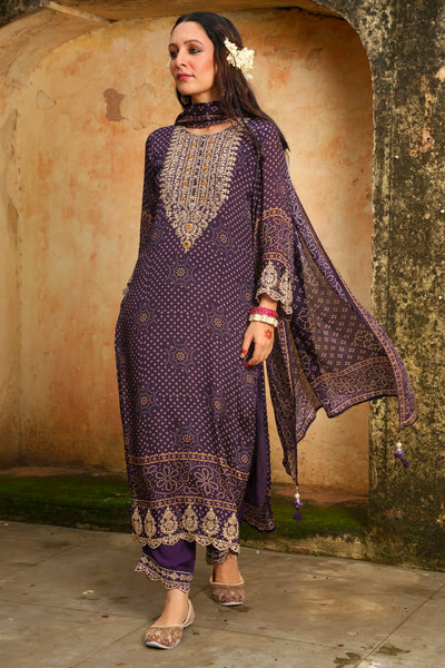 Woman wearing a traditional purple outfit with intricate patterns in an outdoor setting.Woman wearing a traditional purple outfit with intricate patterns in an outdoor setting.