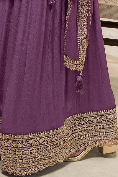 Purple sharara suit with gold embroidery on a neutral backgroundPurple sharara suit with gold embroidery on a neutral background