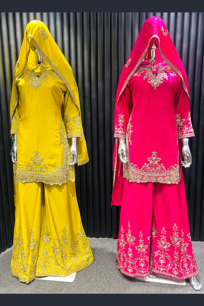 Yellow and pink traditional sharara outfits with embroidered details on a dark backgroundYellow and pink traditional sharara outfits with embroidered details on a dark background